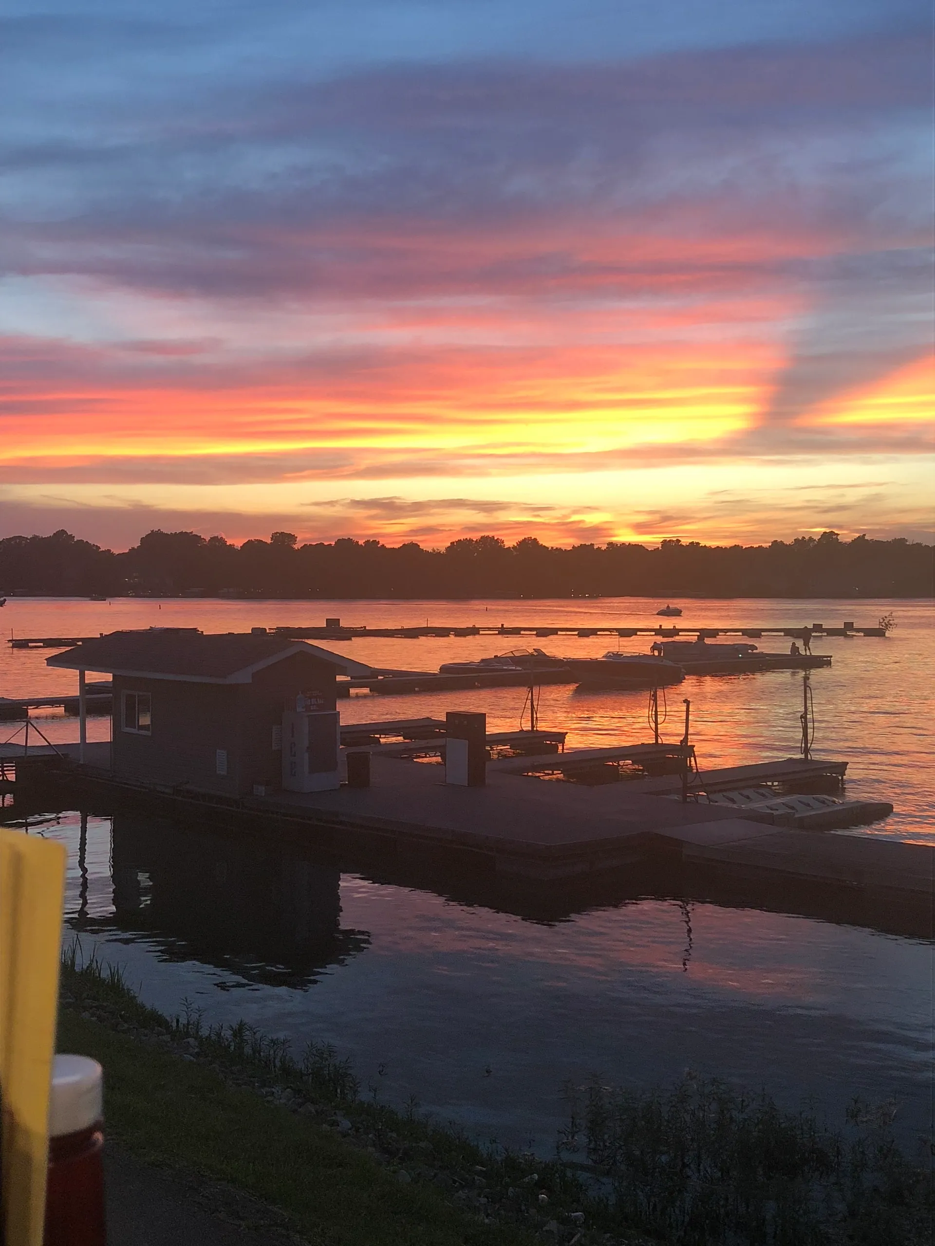 Sunset over the marina, a community gathering spot
